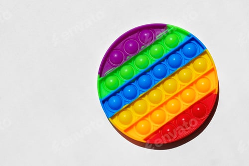 Preview: Colorful antistress pop it toy on white background