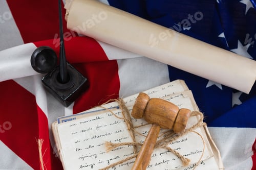Preview: Gavel with tied up documents arranged on American flag