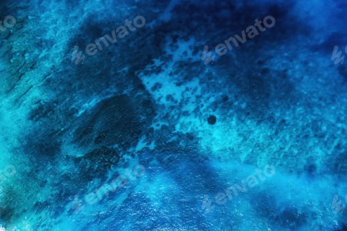 Preview: Seascape at the day time. Water as a background. Turquoise water background from top view.