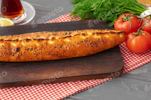 Preview: Close up of Turkish Pide bread on wooden table