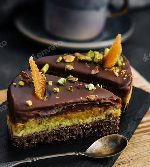 Preview: Slice pistachio cake on wooden board
