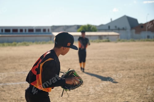 Preview: Baseball players practicing on dusty field during game