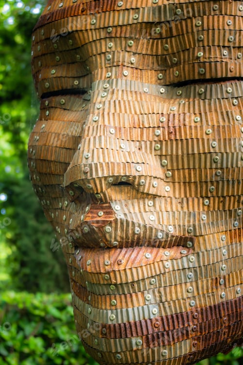 Preview: Wooden face sculpture with riveted eyes