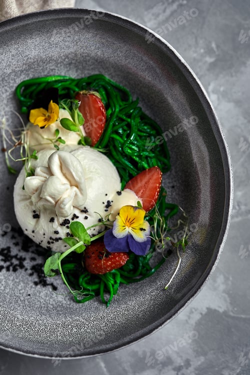 Preview: Burrata salad with strawberries and seaweed, on a gray background. Salad with buratta cheese on a