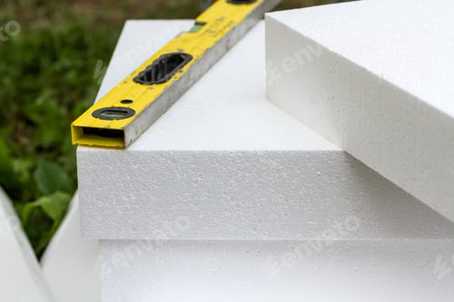 Preview: Close-up detail of stack of white rigid polyurethane foam sheets for house insulation