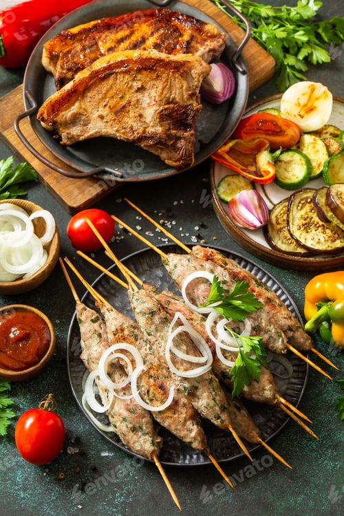 Preview: Homemade Kofta kebabs, grilled steak and grilled vegetables on a skewer with vegetables