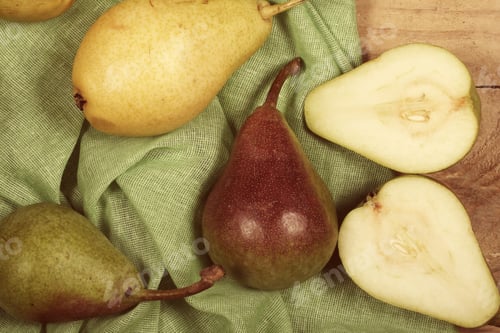 Preview: Fresh Pears Lie On A Wooden Table