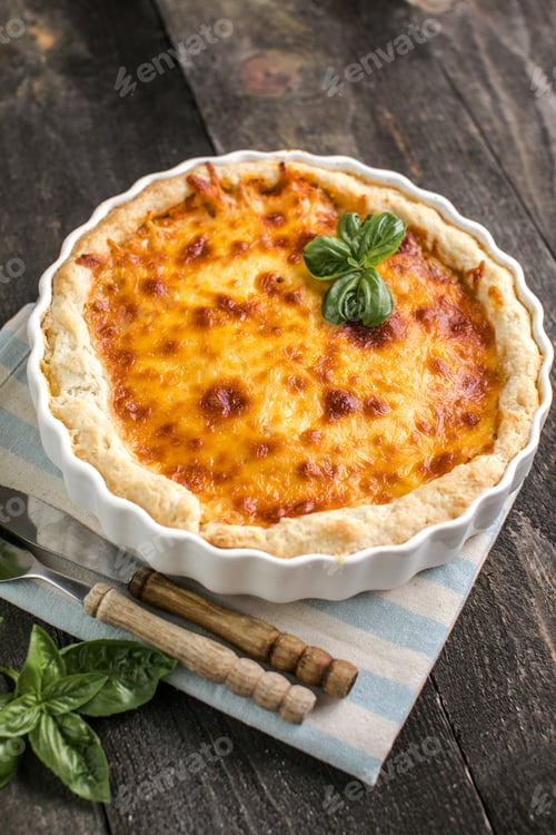 Preview: Quiche. Homemade cheese tart or quiche with cheese, pecorino, bacon and spinach