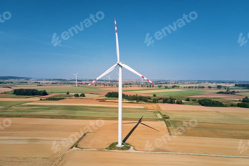 Preview: Windmill turbine in the field at summer day. Rotating wind generator