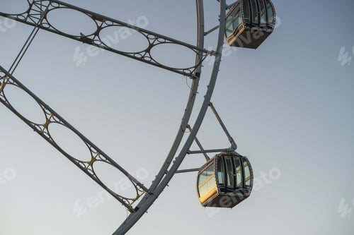 Preview: Cabins of a Ferris wheel in the city with a grey background