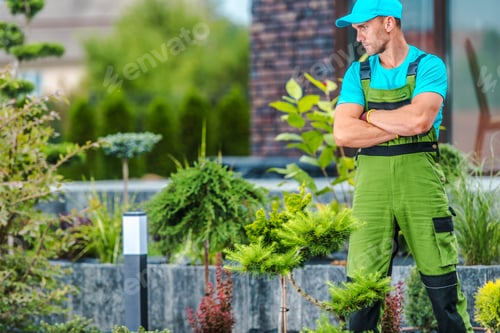Preview: Professional Landscaper Proudly Standing in the Garden