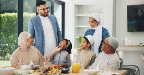 Preview: Islamic, family and dinner in home for ramadan, muslim celebration and food on dining table. Eid mu