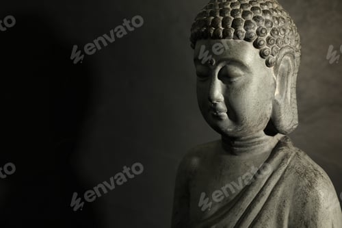 Preview: Buddha statue on dark background, closeup. Space for text