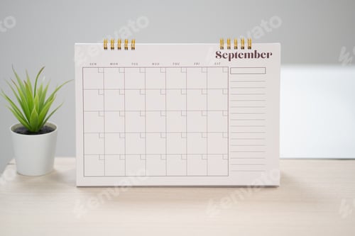 Preview: Desk calendar for september on the table with copy space concept.