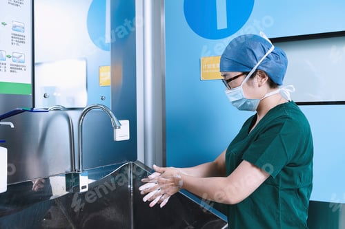 Preview: Theatre nurse washing hands in maternity ward operating theatre