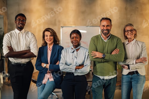 Preview: Portrait of interracial team smiling at the camera at boardroom.
