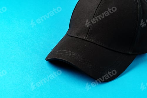 Preview: Baseball caps on blue background studio shot