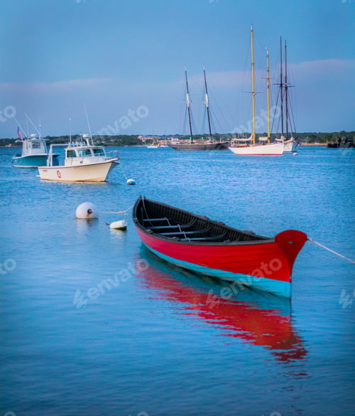 Preview: Row boat sitting off a beach in a harbor