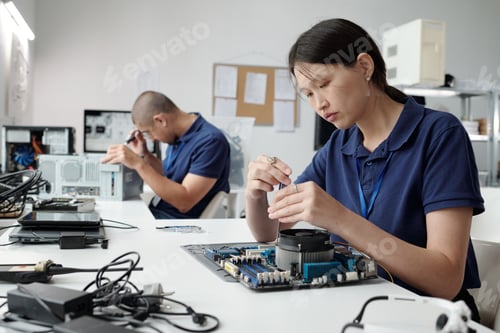 Preview: Technicians Assembling Computer Components in Laboratory