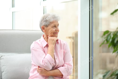 Preview: Portrait of beautiful grandmother in living room