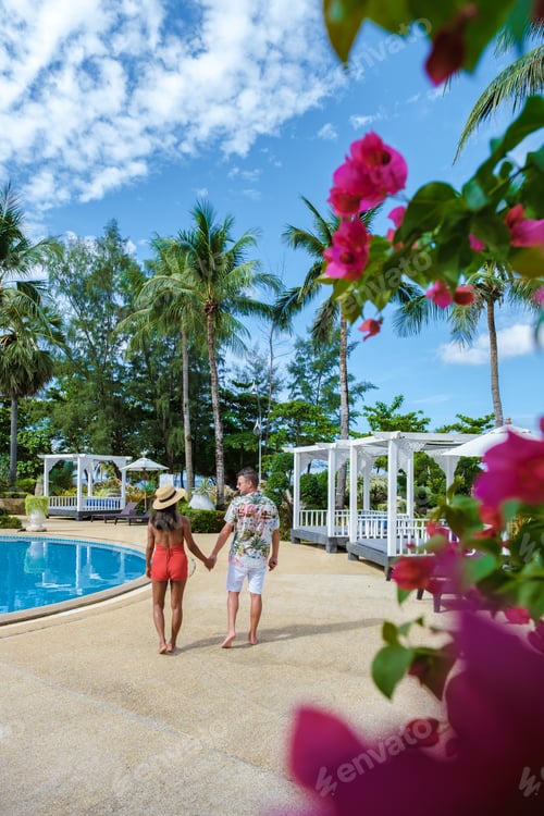 Preview: couple man and woman by swimming pool during a vacation