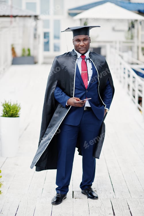 Preview: African american happy successful student at graduation hat.