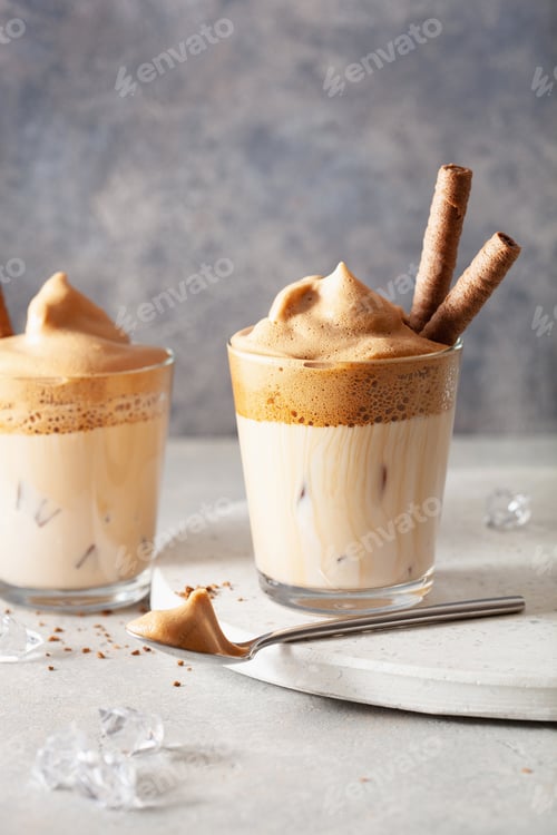 Preview: dalgona coffee in glass. trendy Instant coffee whipped with sugar and hot water