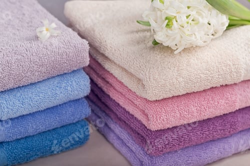 Preview: Two Stacks of Colorful Bath Towels with Hyacinth Flower