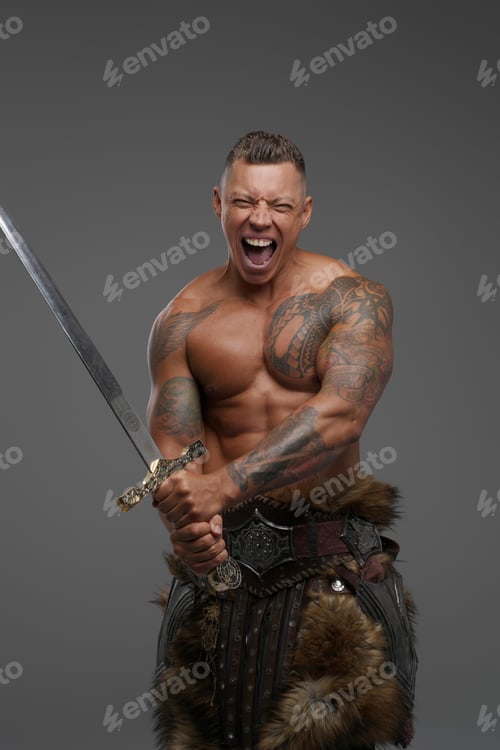 Preview: Violent tattooed warrior with sword isolated on gray background