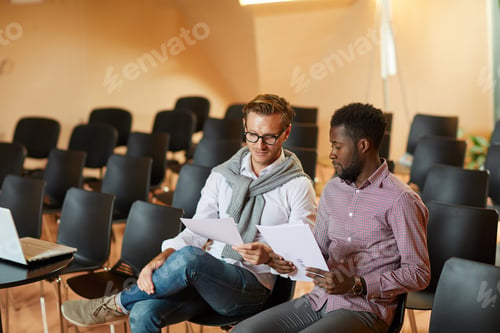 Preview: Colleagues preparing for presentation