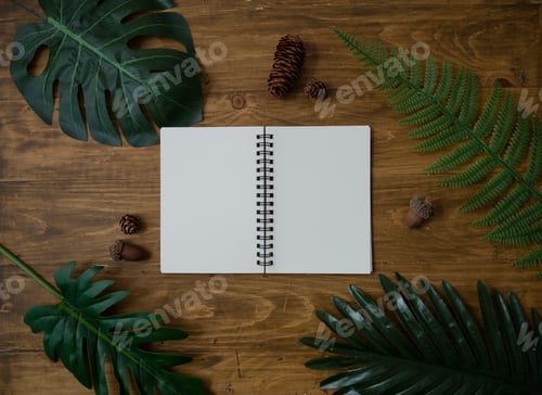 Preview: Backdrop of Blank open white paper notebook, tropical summer plants on wooden background