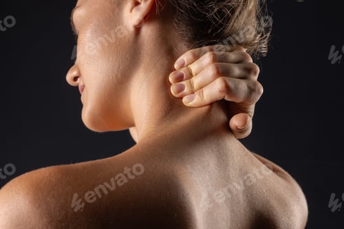 Preview: woman massaging neck close up, concept of neck pain with osteochondrosis protrusion and hernia