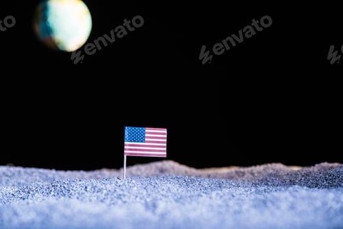 Preview: sandy ground with american flag and blurred planet Earth in space isolated on black