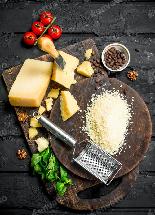 Preview: Grated Parmesan cheese with pine nuts, tomatoes and herbs.