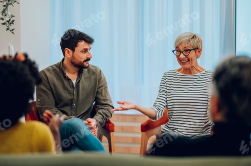 Preview: Diverse people talking about their mental health on a group therapy session