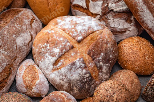 Preview: Freshly baked natural bread is on the kitchen table.