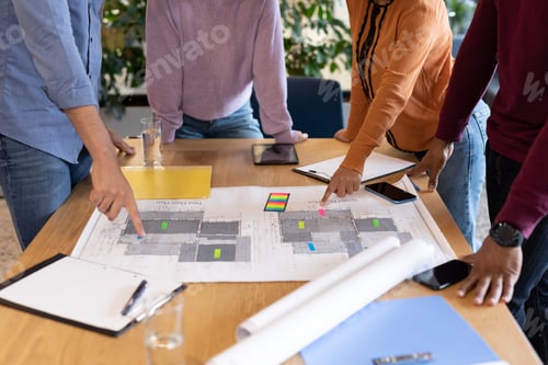 Preview: Diverse group of business people working in creative office