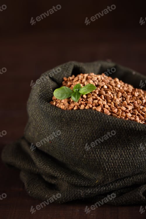 Preview: natural organic buckwheat on a wooden table