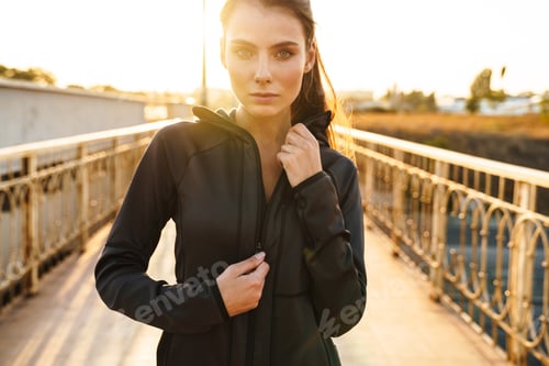 Preview: Amazing sports fitness woman posing outdoors.