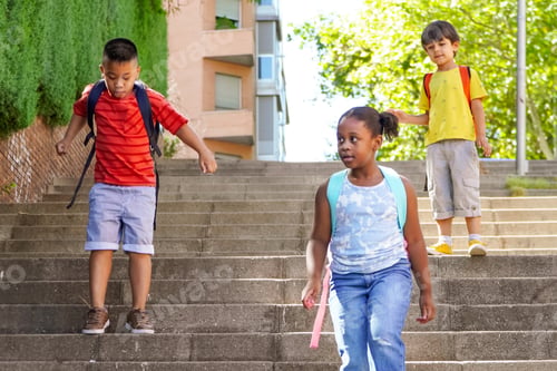 Preview: multiethnic kids with backpacks on the way to school.
