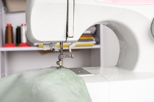 Preview: Modern Sewing Machine Presser Foot With Green Fabric And Thread