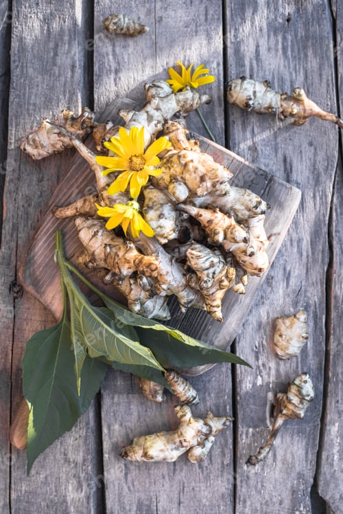 Preview: Raw jerusalem artichoke. Topinambur vegetable root on wooden table.