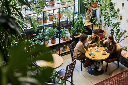Preview: Two friends or dates having chat while young woman drinking latte