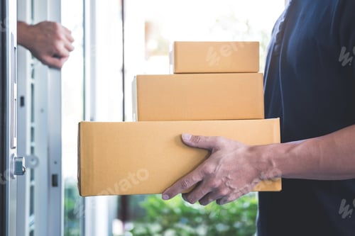 Preview: Delivery mail man giving parcel box to recipient