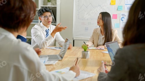 Preview: Group of Asia business people discussing business brainstorming meeting ideas strategy in office.