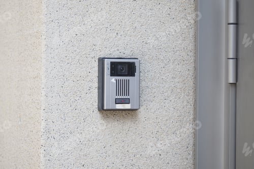 Preview: Security camera mounted on wall for monitoring activities