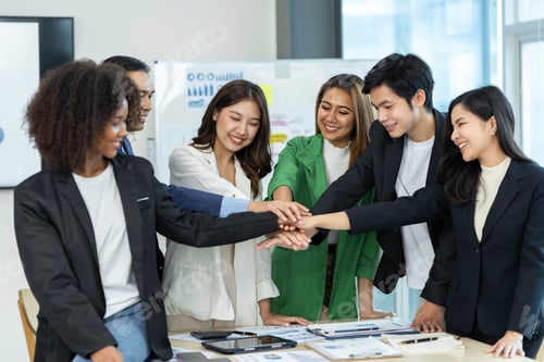 Preview: Group of business people joining hand together for making a deal