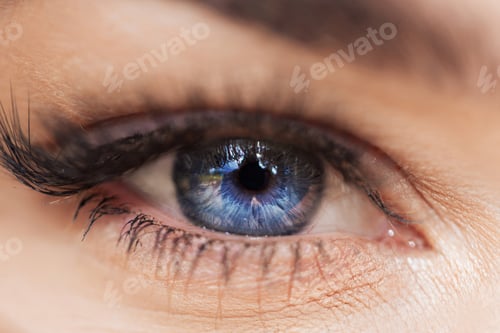 Preview: Amazing blue female eye, macro. Beautiful charming eye texture with light and depth.