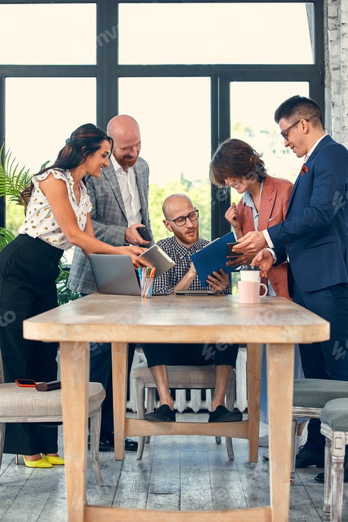 Preview: Too many work. Selective focus of young business man surrounded by colleagues, each proposes a