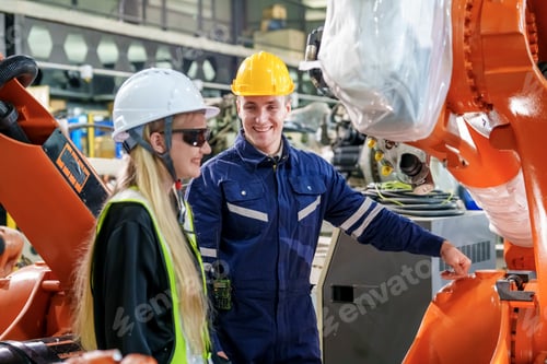 Preview: Engineers collaborate in a robotics workshop, highlighting teamwork and innovation